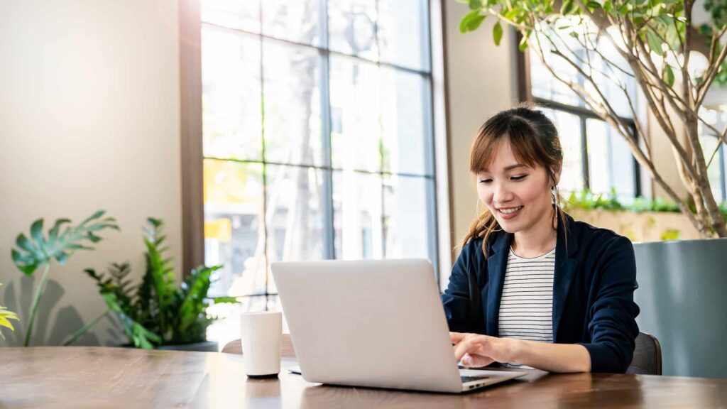 Woman typing on her computer